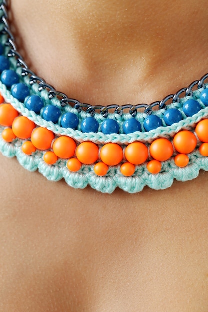 Free photo trendy blue and orange beads necklace