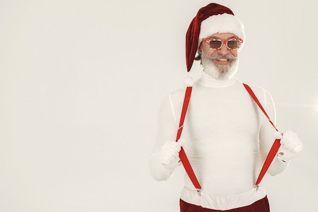 Free Photo trendy grey-haired santa. man wear knitted clothes. grandfather in a santa's hat.