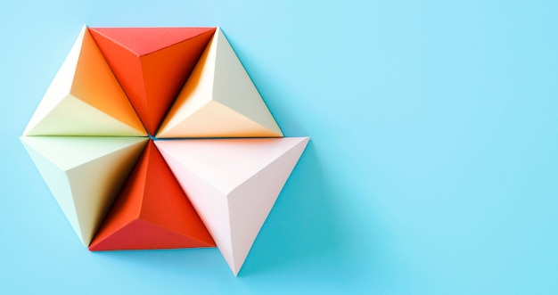 Free Photo triangle origami paper shape with copy-space