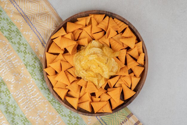 Triangle shaped chips on wooden plate