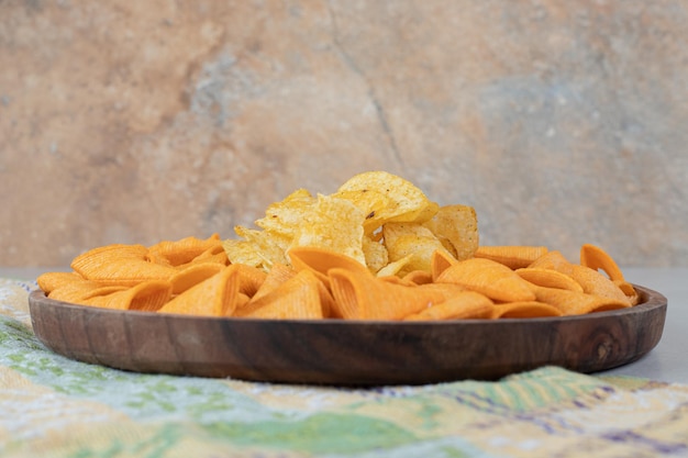 Triangle shaped chips on wooden plate