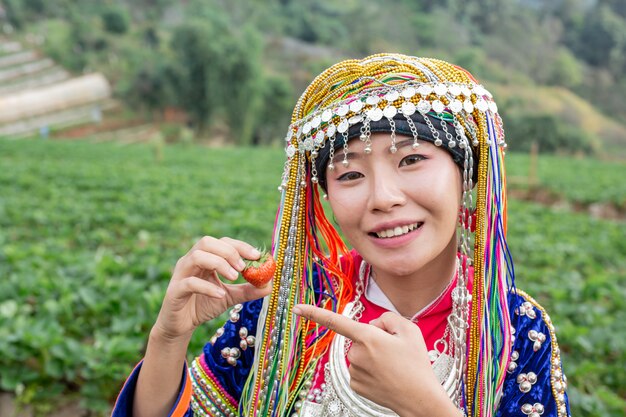 Tribal girls are collecting strawberries 