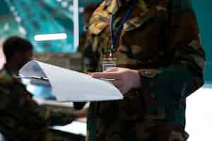 Free photo trooper reading federal case file for a new defense operation