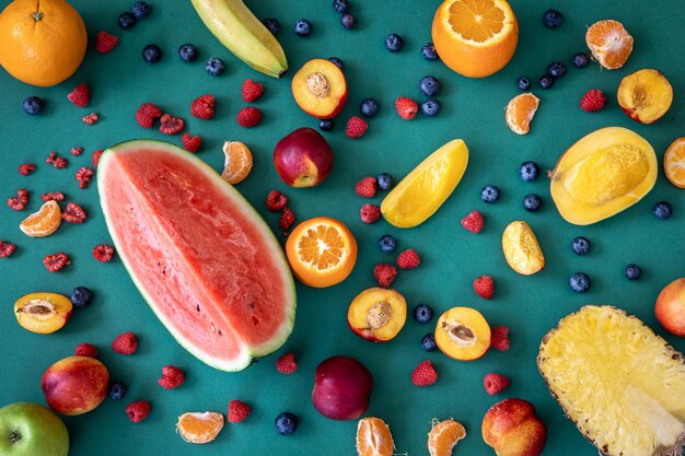 Tropical fruits on a blue background flat lay