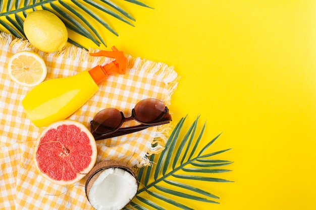 Tropical layout of beach accessories and fruit 