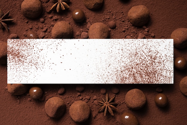 Free photo truffles and cocoa powder with rectangle mock-up