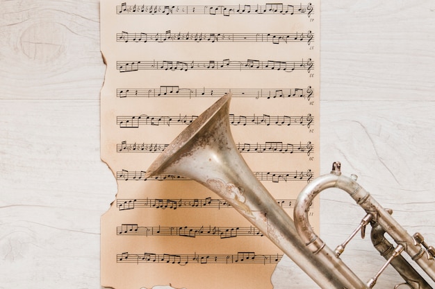 Trumpet on old page of sheet music