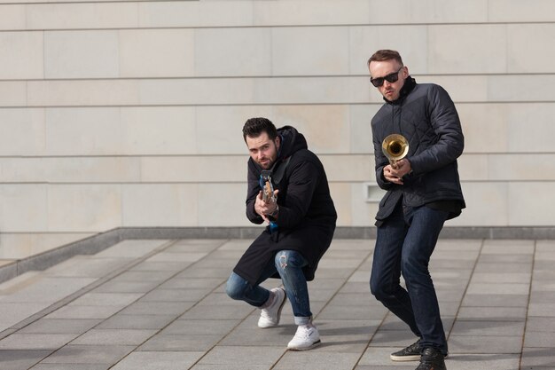 Trumpet player and guitarist fooling