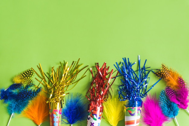 Trumpets with serpentine and colored feathers