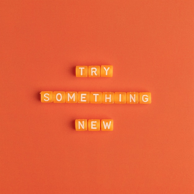 Free photo try something new beads message typography