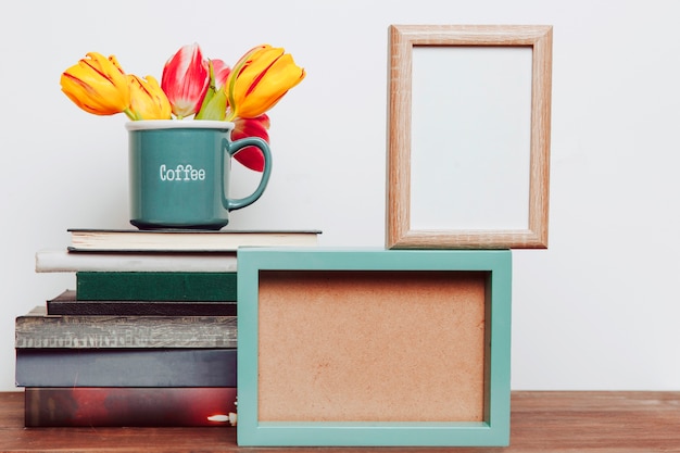 Tulips on books near frames