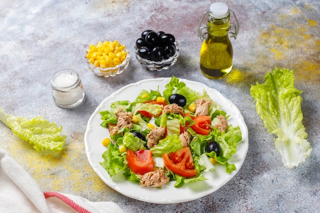 Tuna salad with lettuce,olives,corn,tomatoes