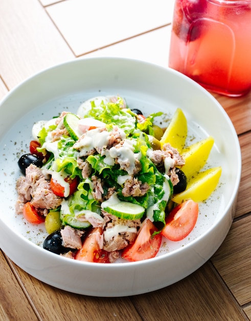 Tuna salad with olives tomatoes and lettuce