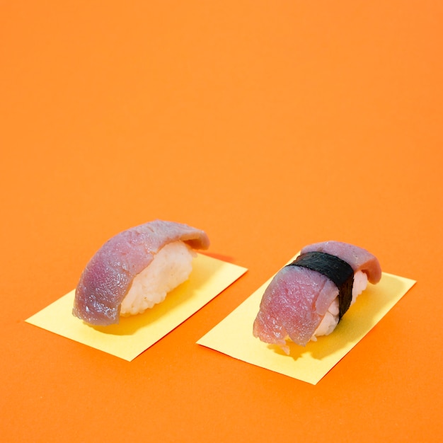 Free Photo tuna sushi on orange background