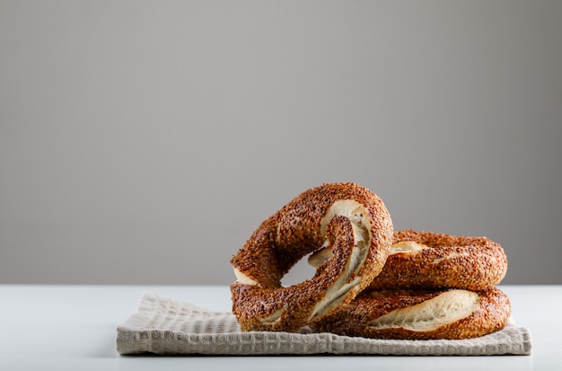 Free photo turkish bagel on a white table and gray surface. side view. space for text