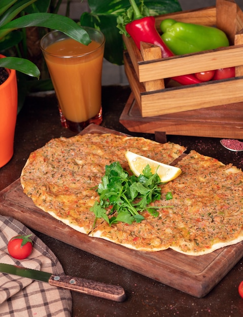 Turkish dishes: lahmacun, turkish pizzas, lemon, parsley 