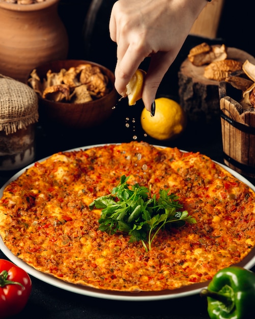 turkish lahmajun with meat, herbs and lemon juice