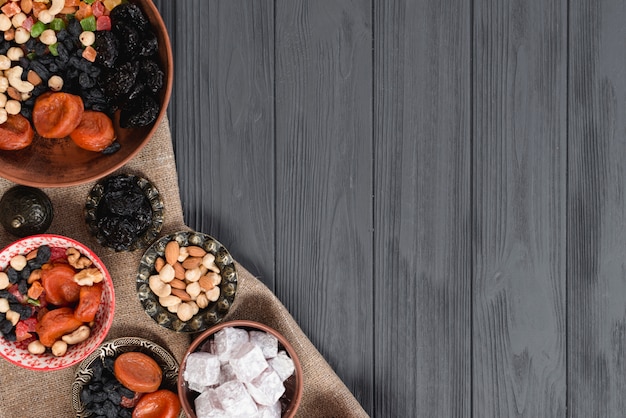 Turkish ramadan sweets and dried fruits on black wooden table