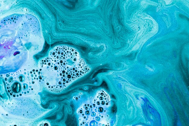 Turquoise water with fizzy bath bomb