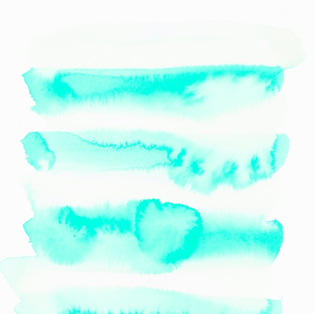 Free photo turquoise watercolor stain isolated on white background