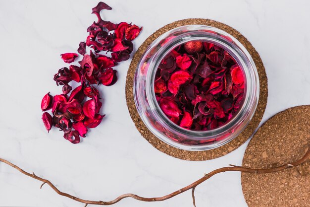 Twig near jar with petals