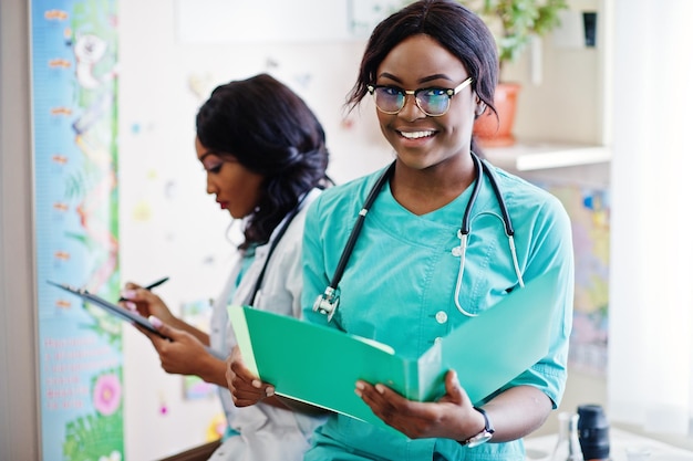 Two african american pharmacist working in drugstore at hospital pharmacy African healthcare