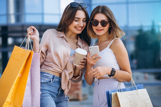 Two beautiful women shopping in town