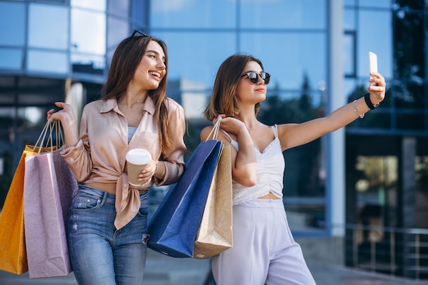 Two beautiful women shopping in town