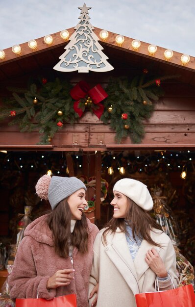 Two best female friends on Christmas market