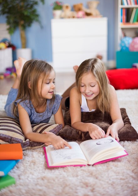 Two best friends reading an adventure book