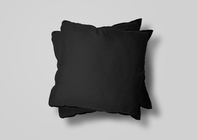 Two black cushions over white surface