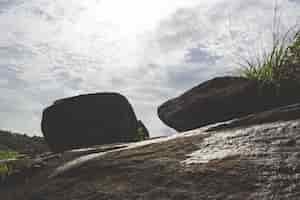 Free photo two boulders at the top of a hill