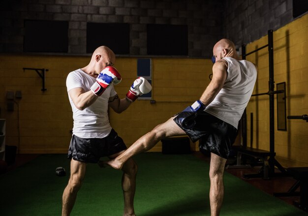 Two boxer practicing boxing in fitness studio