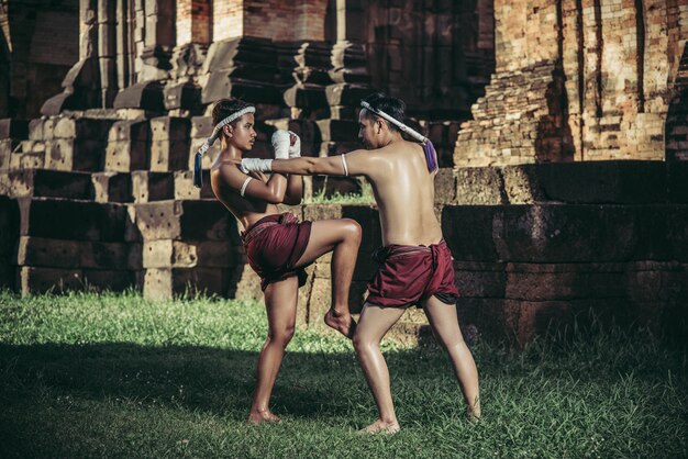 Free photo two boxers fight with the martial arts of muay thai.