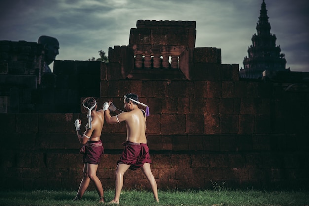 Free photo two boxers fight with the martial arts of muay thai.