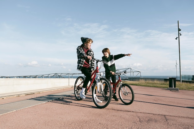 Free photo two boys with their bikes outdoors