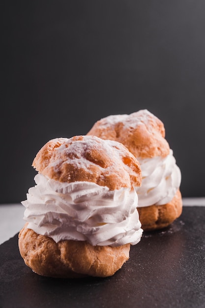 Two brewing cakes with white cream