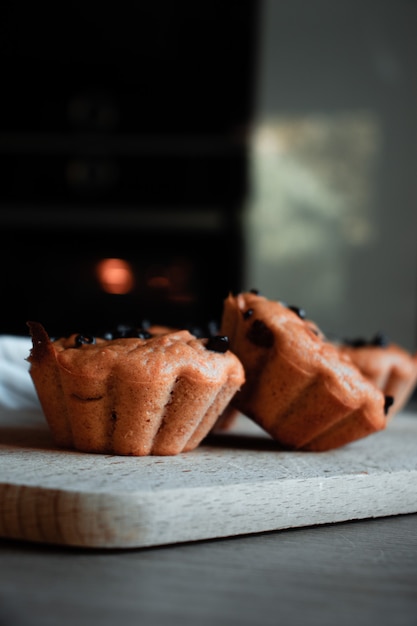 Two brown cupcakes with fruits