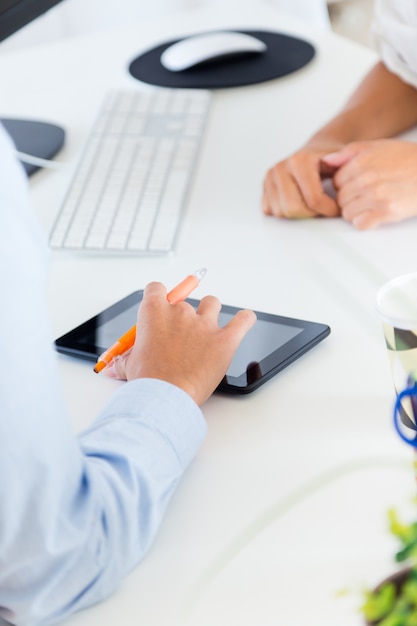 Free photo two business woman working in office with digital tablet.