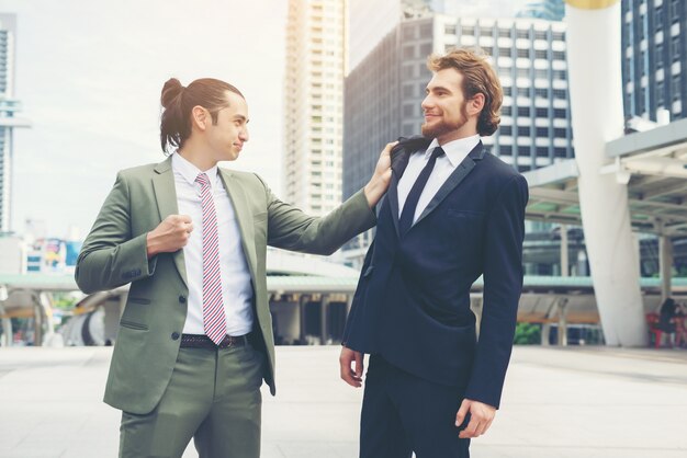 Two businessmen mad each other  trying to come to an agreement.