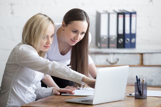 Two businesswomen working together