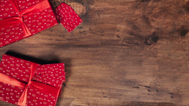 Two christmas presents on wooden texture