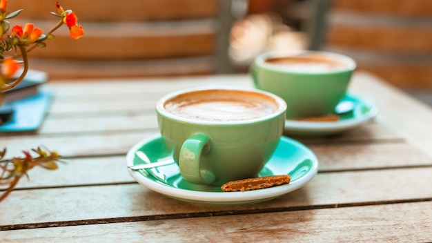 Two coffee cup on wooden table