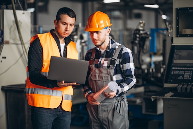 Free Photo two colleagues at a factory