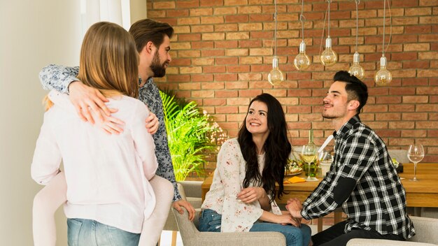 Two couples talking to each other