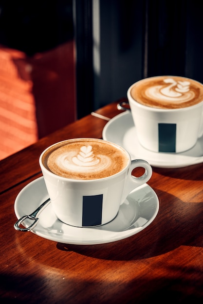 Two cups of coffee with latte art