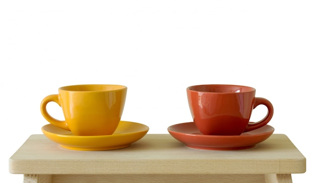 Two cups on wooden board