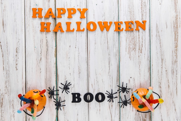 Free photo two cute baskets and happy halloween caption