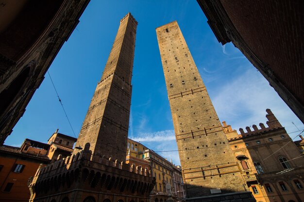 Two famous falling towers Asinelli and Garisenda in the morning, Bologna, Emilia-Romagna, Italy