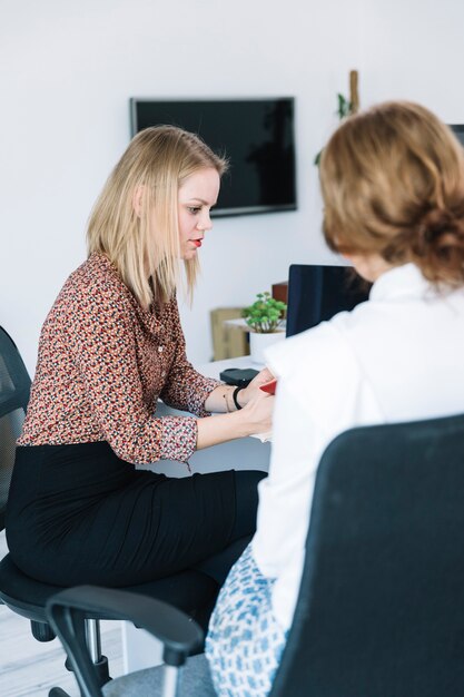 Two female businesspeople working in office